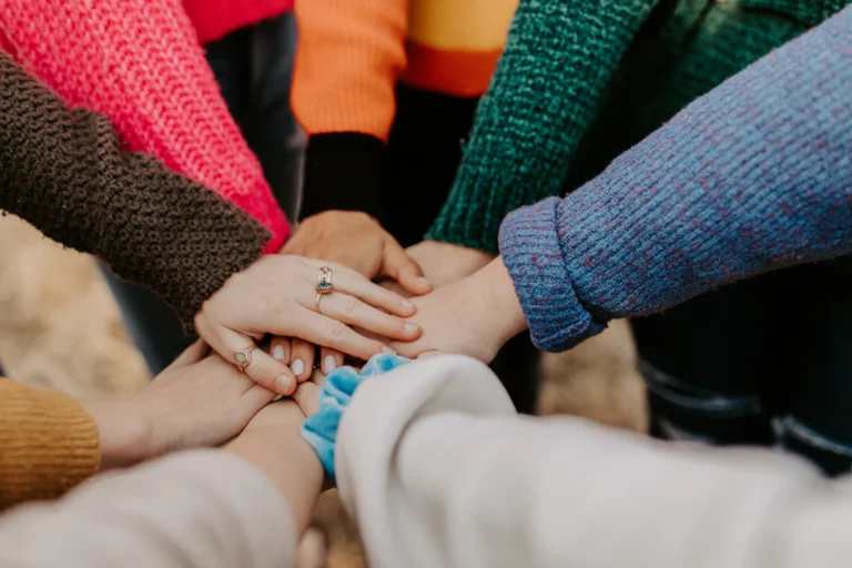 Students with hands joined at a community service event