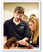 A Capitol School instructor working with students