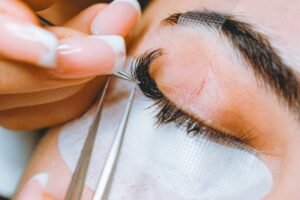 Lash extensions meticulously applied by certified, licensed professional
